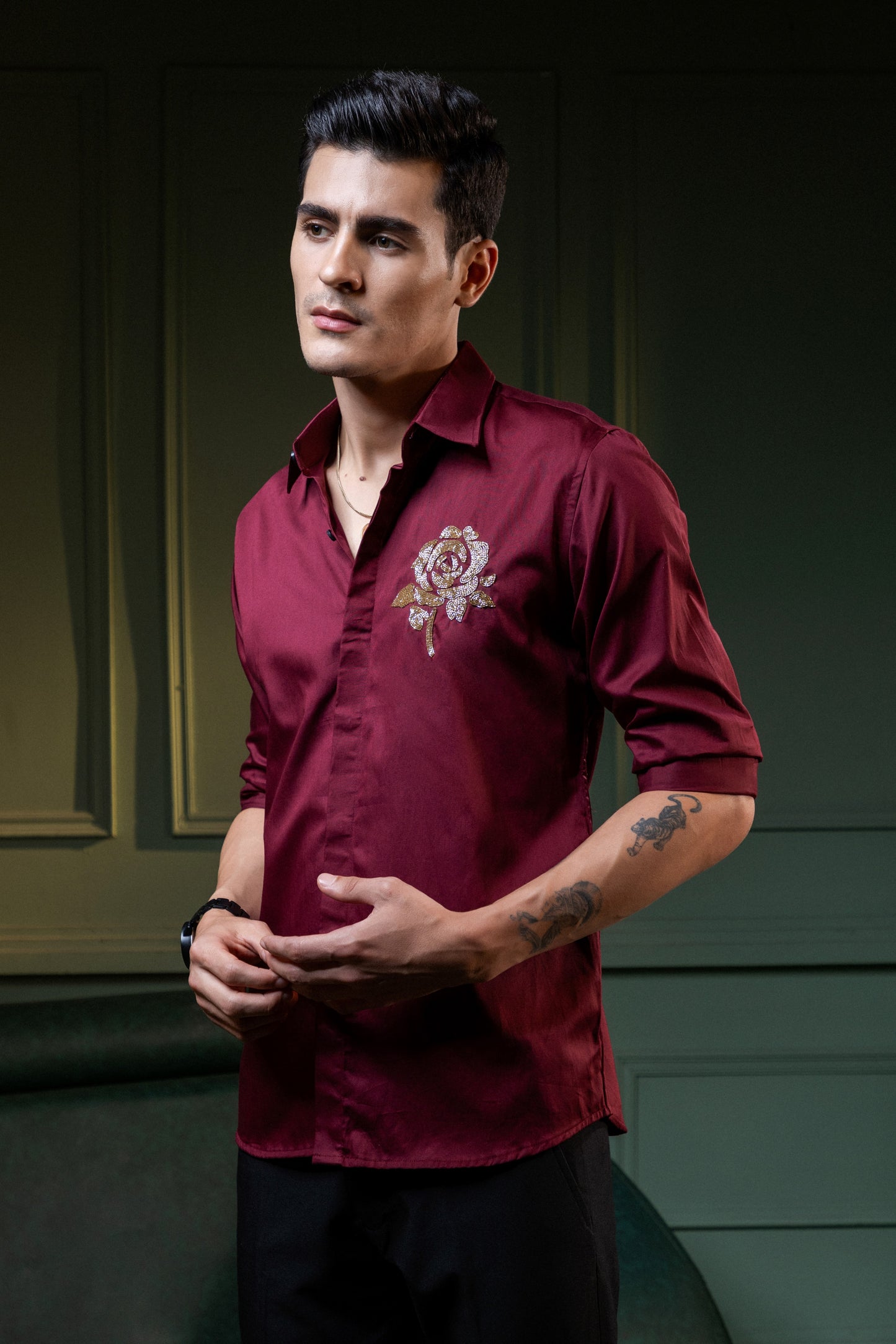 GOLDEN FLOWER EMBROIDERED ON A MAROON SHIRT