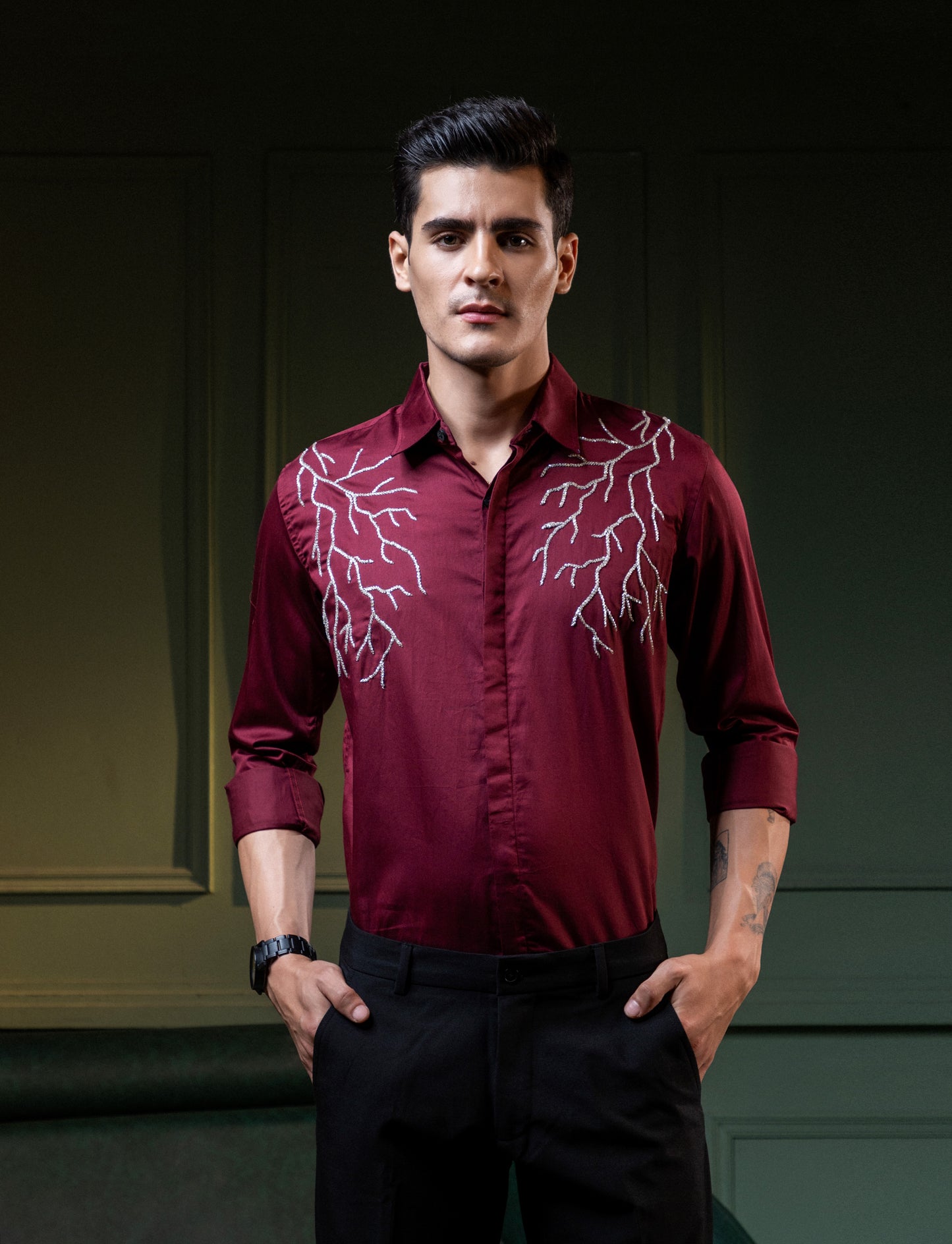 SILVER LIGHT EMBROIDERED ON A MAROON SHIRT