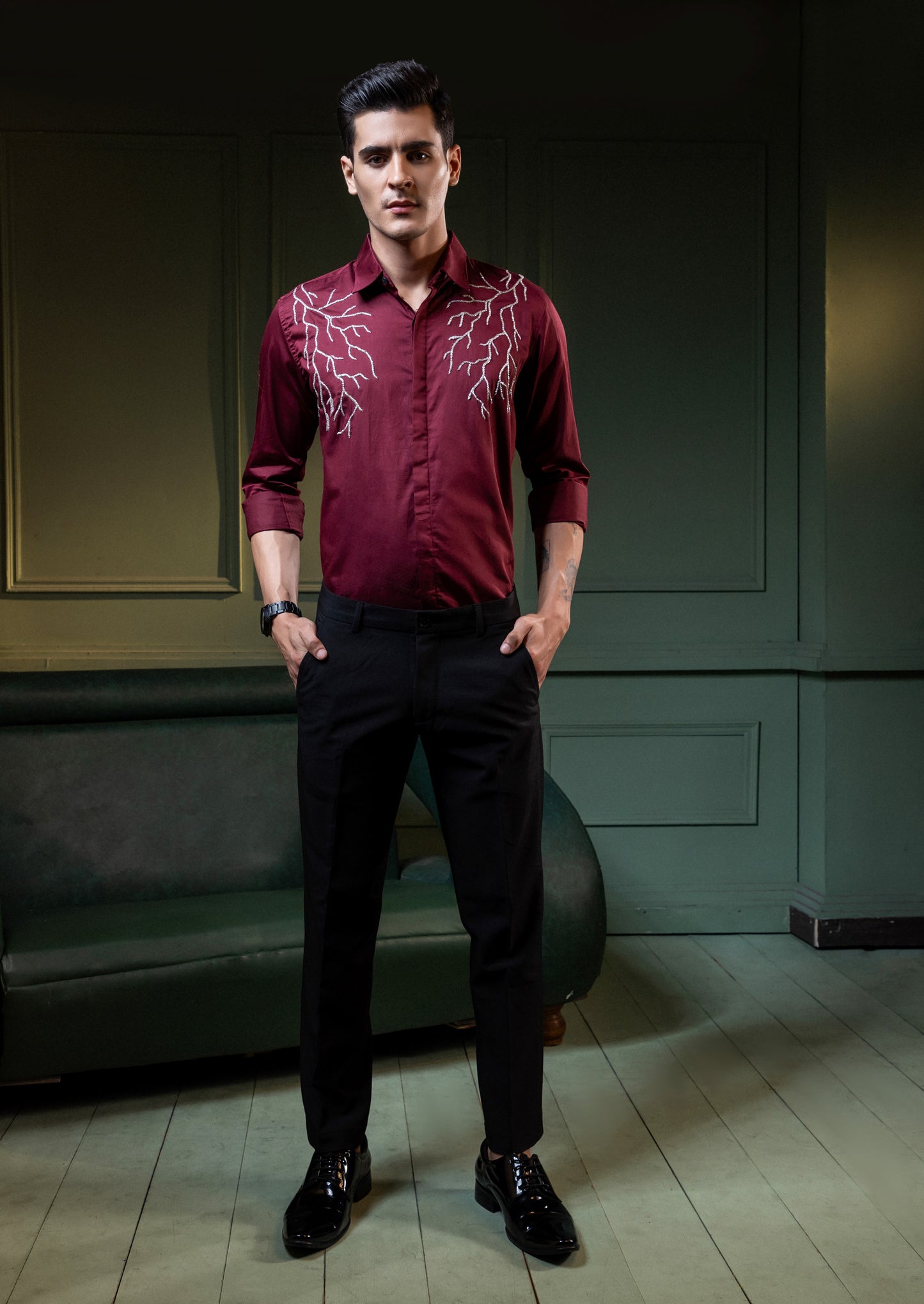 SILVER LIGHT EMBROIDERED ON A MAROON SHIRT