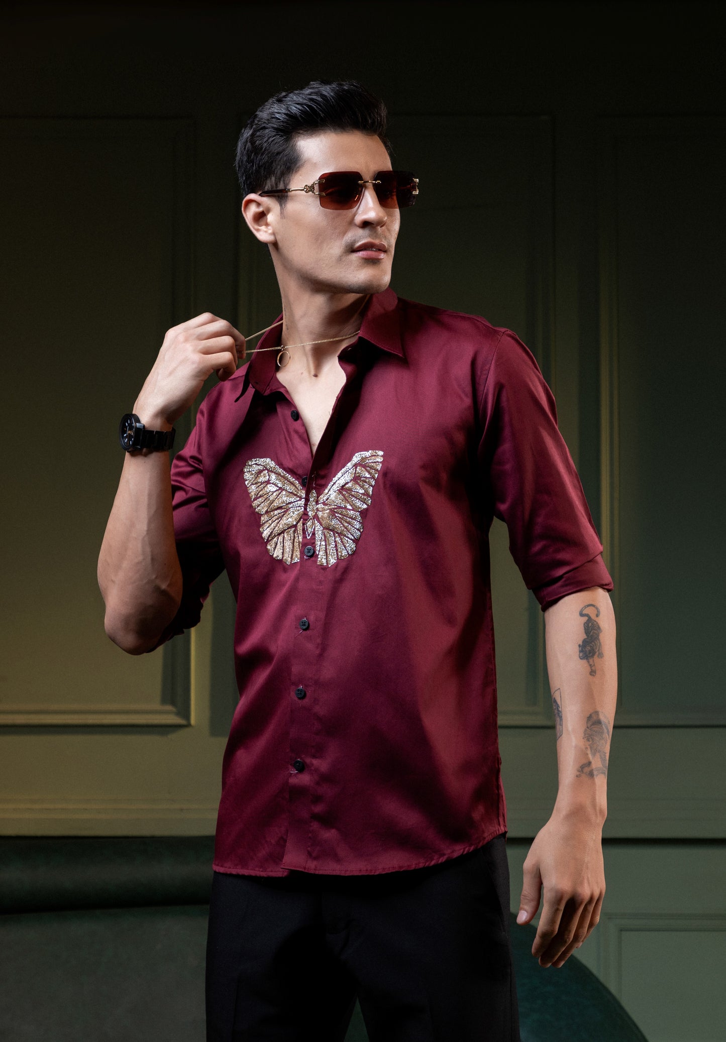"BUTTERFLY" EMBROIDERED ON A MAROON SHIRT