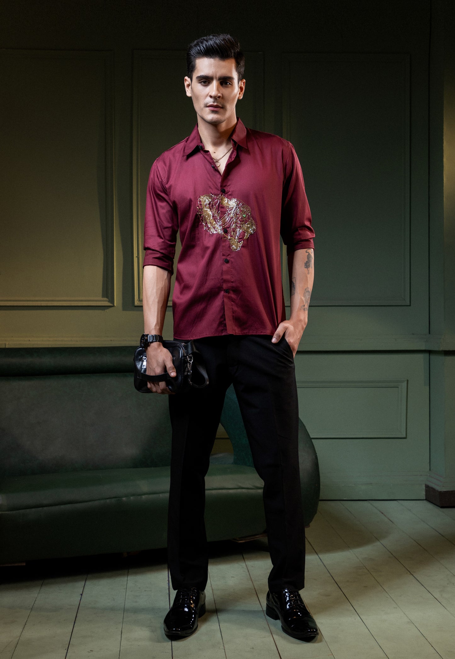 ROARING TIGER EMBROIDERED ON A MAROON SHIRT