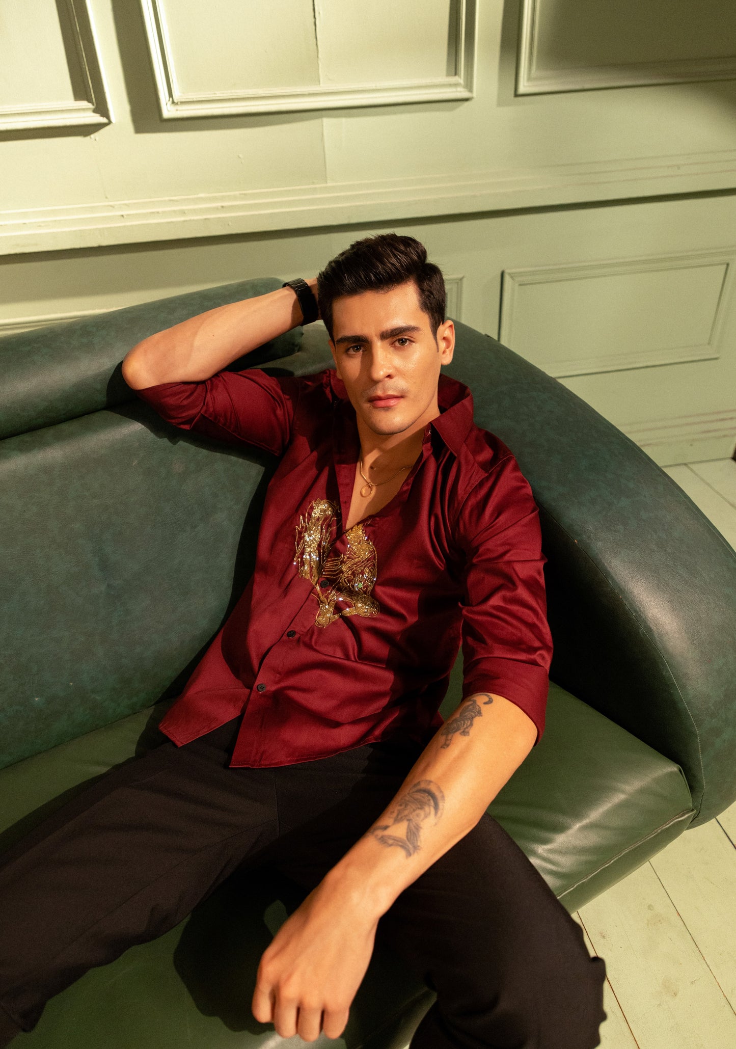 ROARING TIGER EMBROIDERED ON A MAROON SHIRT
