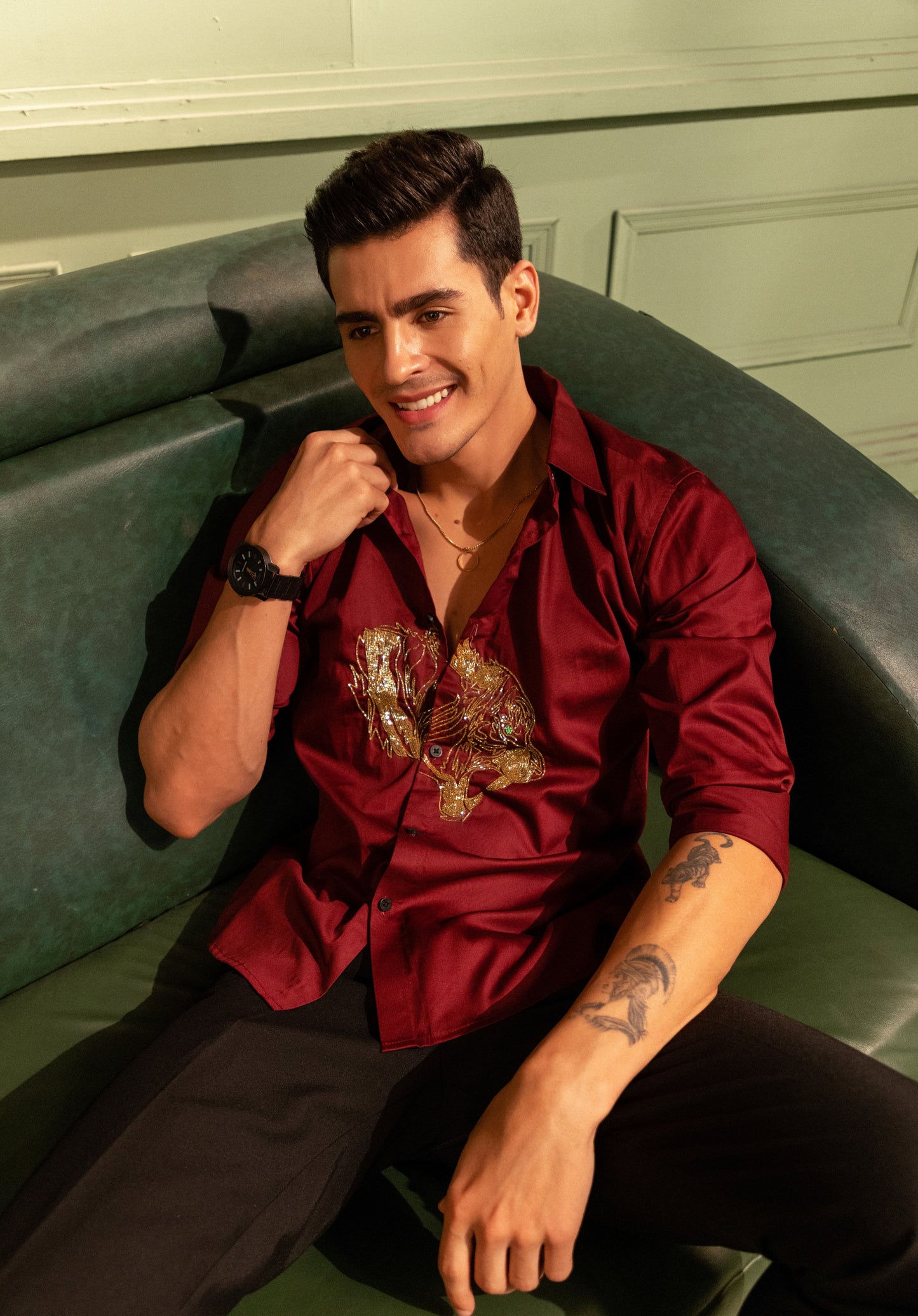 ROARING TIGER EMBROIDERED ON A MAROON SHIRT