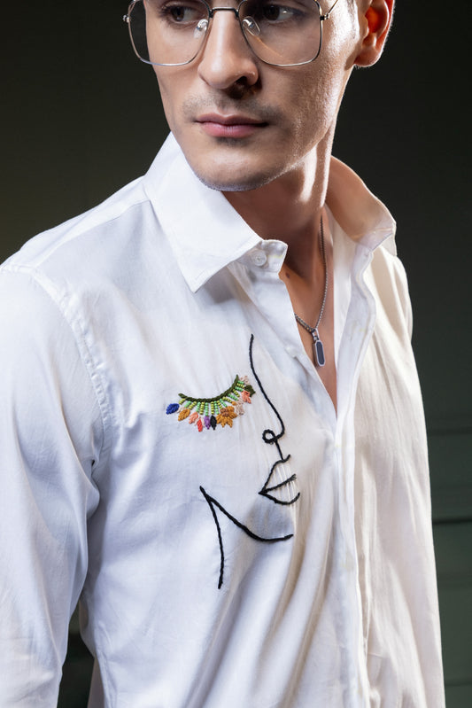 "LADY FACE" EMBROIDERED ON A WHITE SHIRT