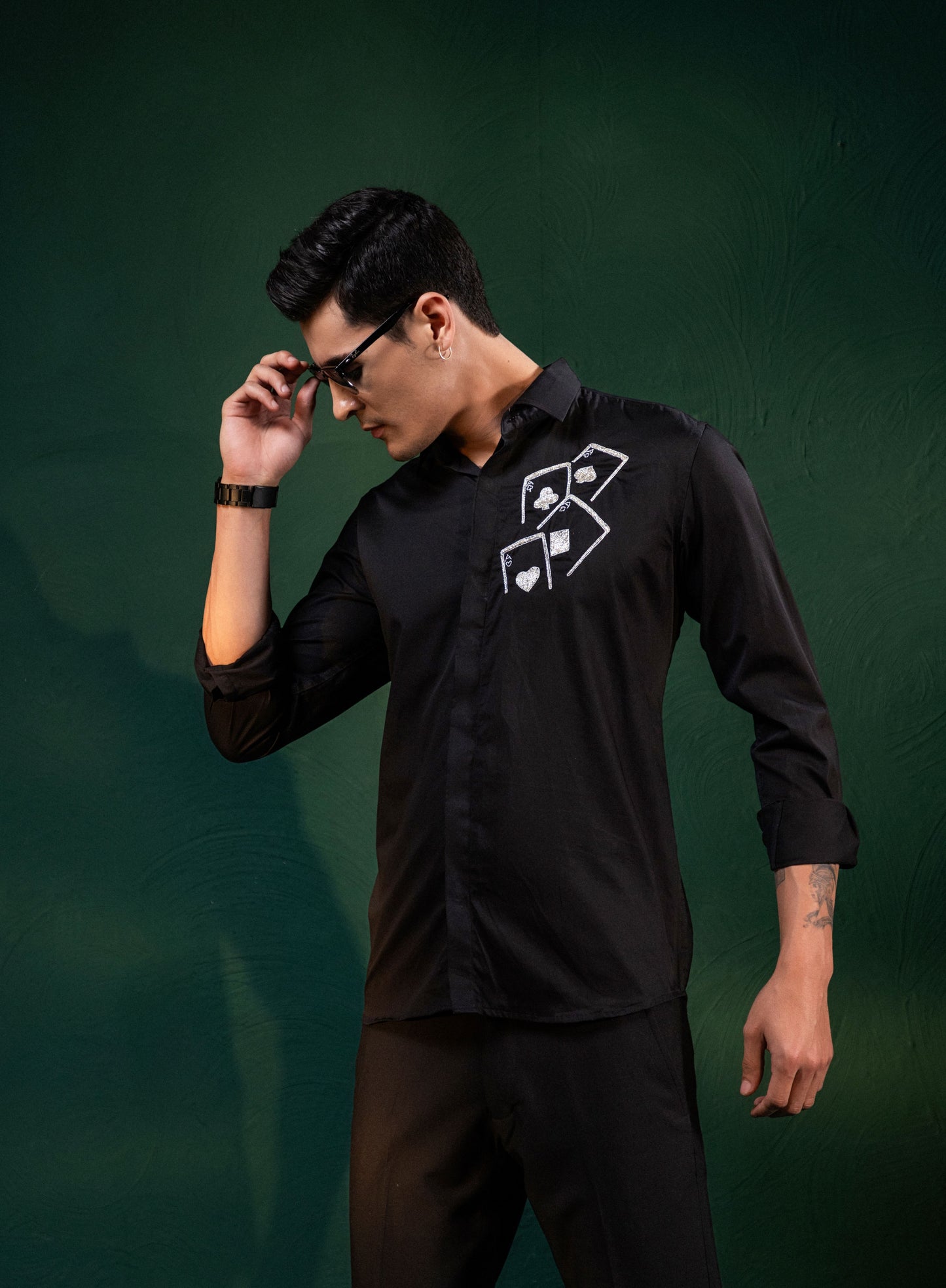 ACES EMBROIDERED ON A BLACK SHIRT