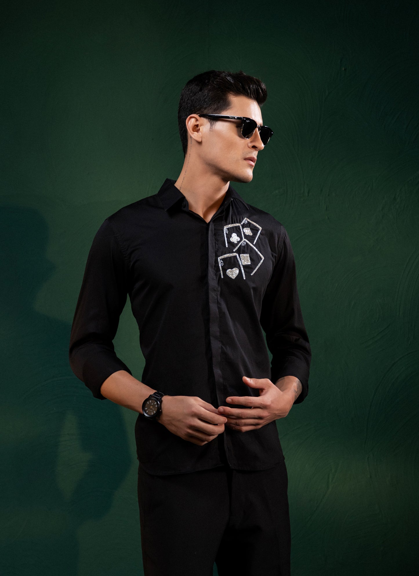ACES EMBROIDERED ON A BLACK SHIRT