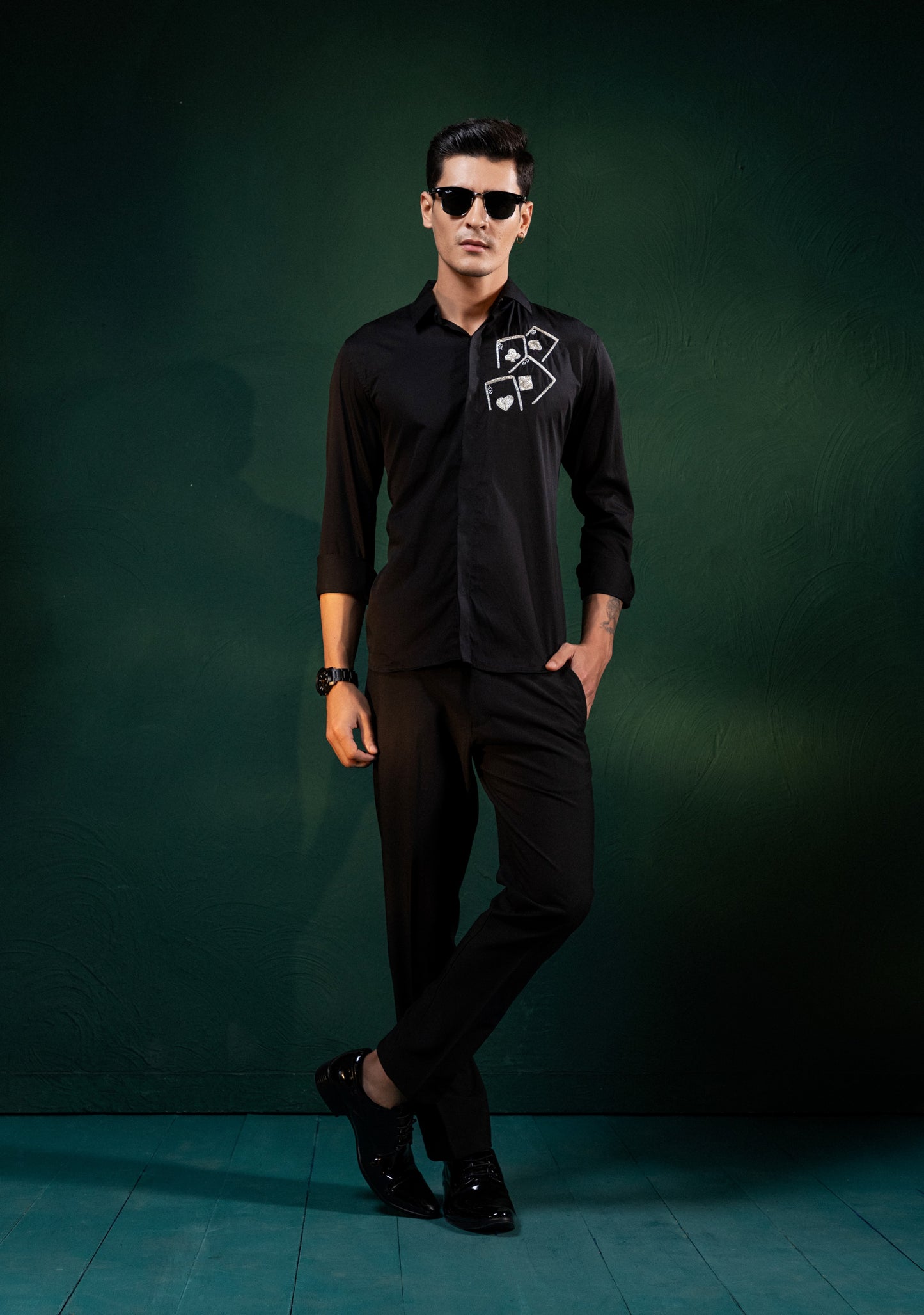 ACES EMBROIDERED ON A BLACK SHIRT
