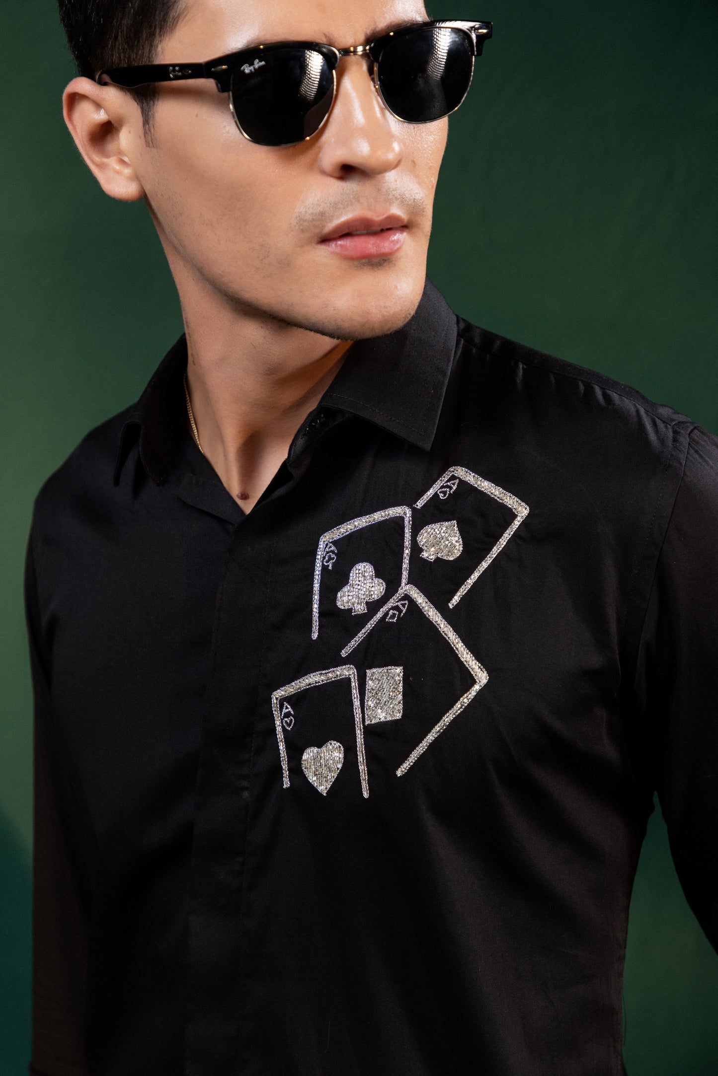 ACES EMBROIDERED ON A BLACK SHIRT