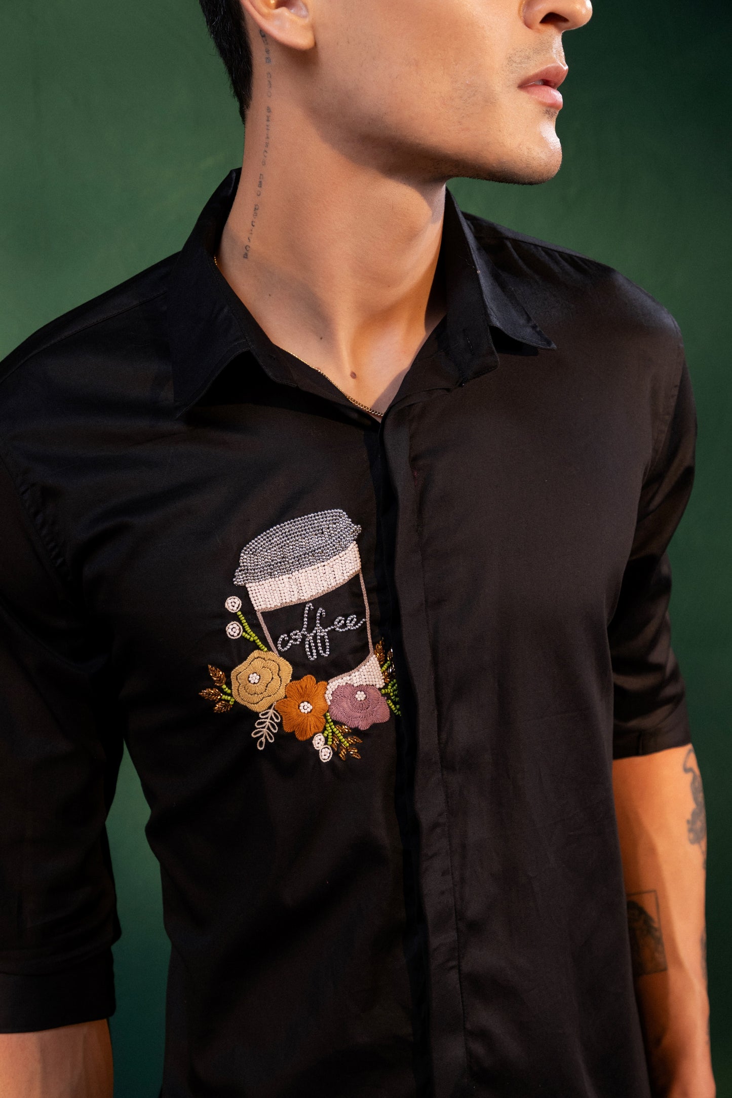 A MUG OF COFFEE EMBROIDERED ON A SHIRT