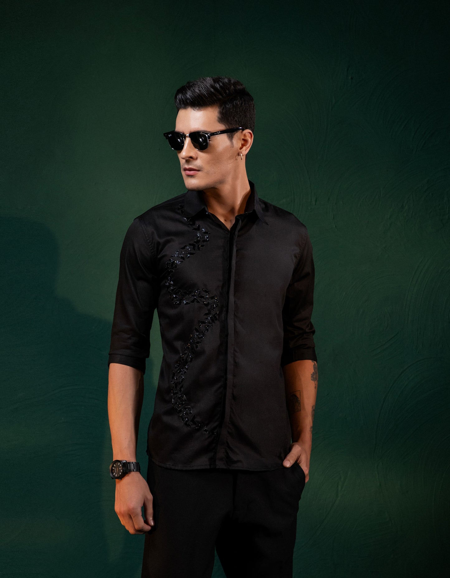 A SPIRAL SHAPED EMBROIDERY ON A BLACK SHIRT