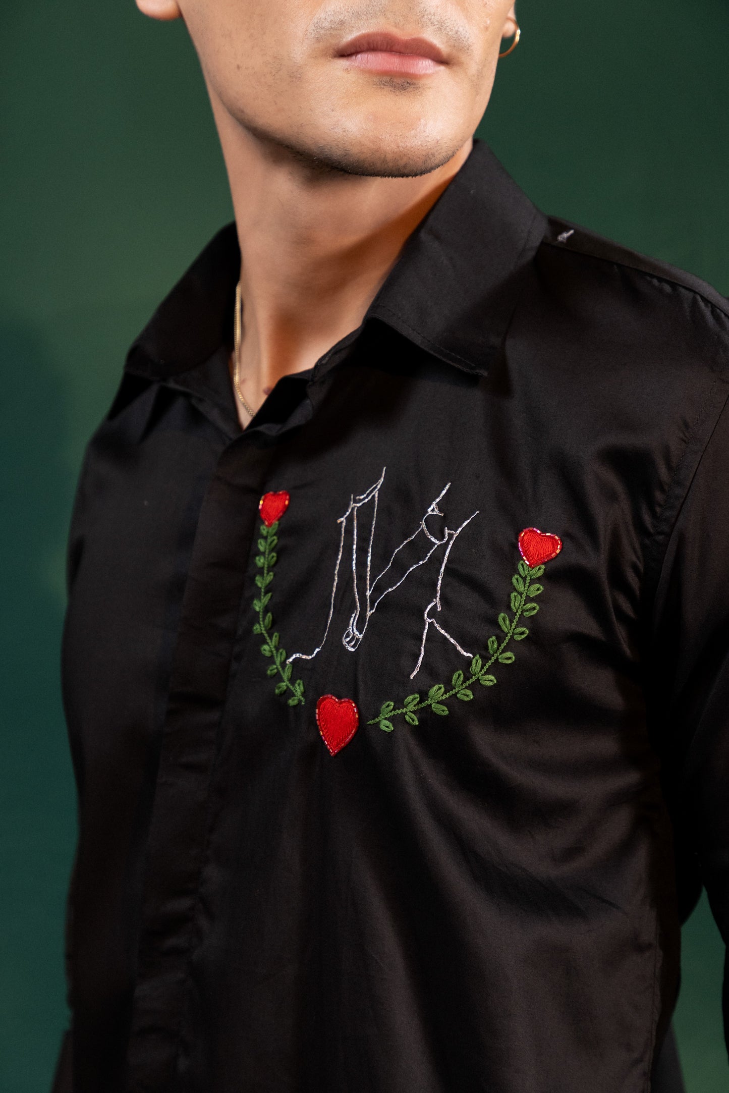 "GIRL AND A BOY HOLDING HAND" EMBROIDERED ON A SHIRT