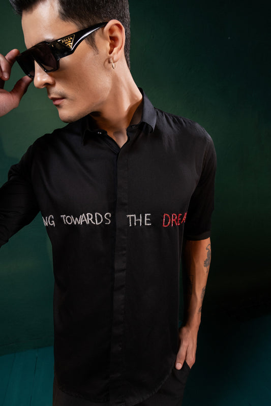 "FLYING TOWARDS THE DREAM" EMBROIDERED ON A SHIRT