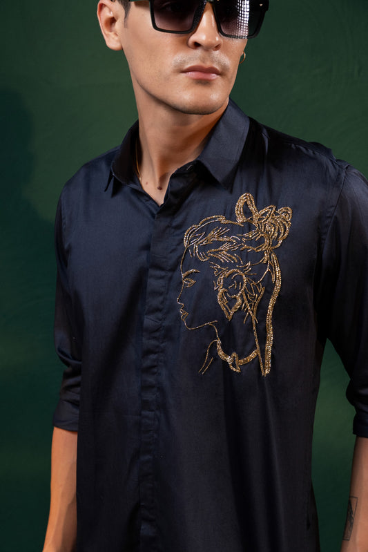 A BEAUTIFUL GIRL'S  FACE EMBROIDERED ON A SHIRT