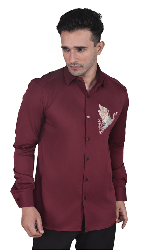 FLYING BIRD EMBROIDERED ON A MAROON SHIRT