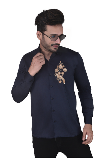 BIRD BEAUTIFULLY EMBROIDERED ON A SHIRT