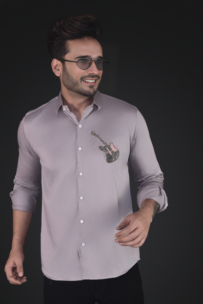 GUITAR EMBROIDERED ON A SHIRT