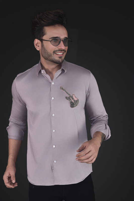 GUITAR EMBROIDERED ON A SHIRT
