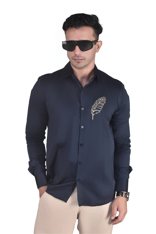 FEATHER EMBROIDERED ON A NAVY BLUE SHIRT