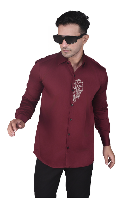 HALF LION FACE EMBROIDERED ON A MAROON SHIRT