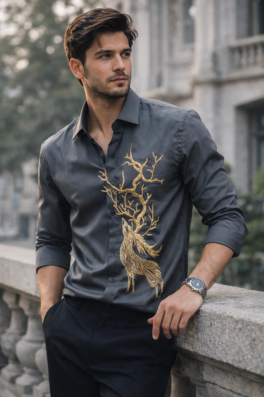 A REINDEER HAND EMBROIDERED ON A BLACK SHIRT