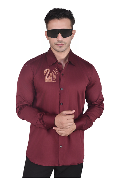 SWAN HAND EMBROIDERED ON A MAROON SHIRT