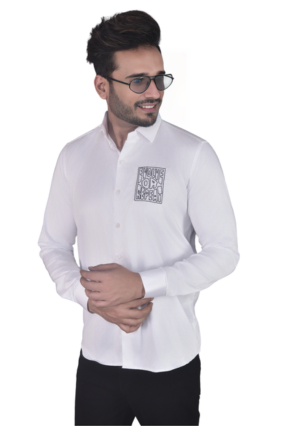 'EVOLVE OR REPEAT' HAND EMBROIDERED ON A WHITE SHIRT