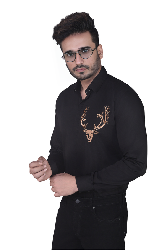 REINDEER EMBROIDERED ON A BLACK SHIRT
