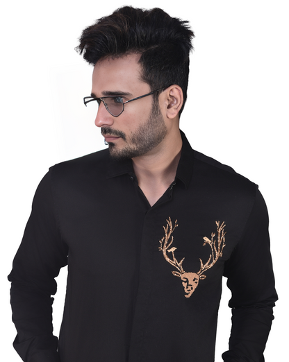 REINDEER EMBROIDERED ON A BLACK SHIRT
