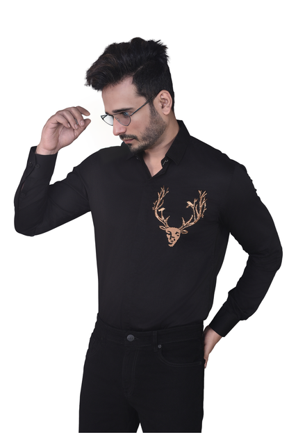 REINDEER EMBROIDERED ON A BLACK SHIRT