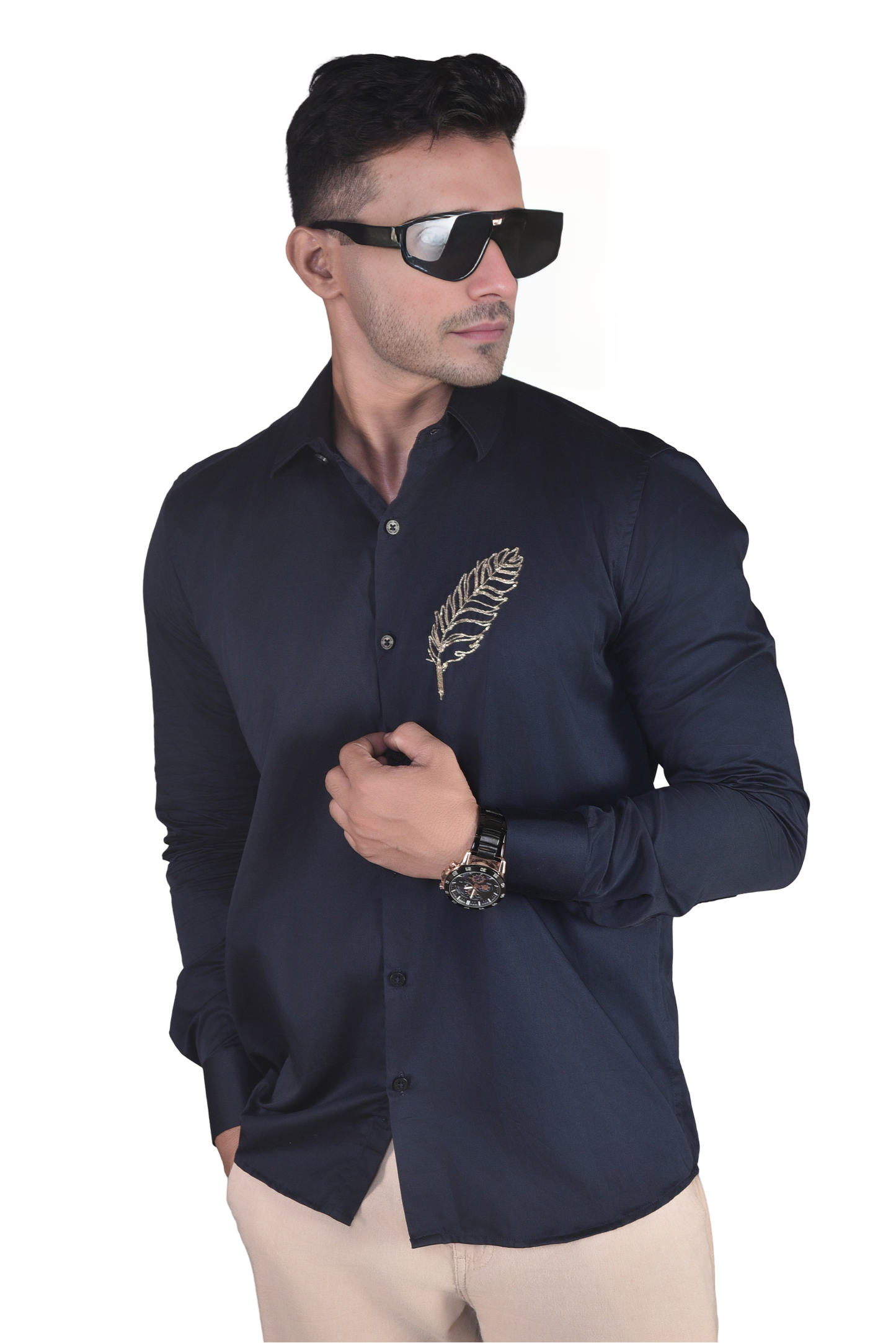 FEATHER EMBROIDERED ON A NAVY BLUE SHIRT