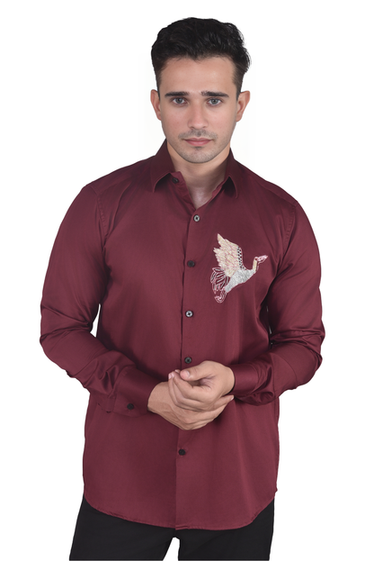 FLYING BIRD EMBROIDERED ON A MAROON SHIRT