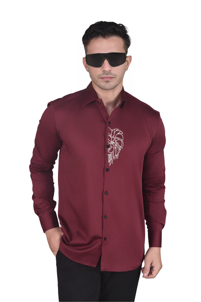 HALF LION FACE EMBROIDERED ON A MAROON SHIRT