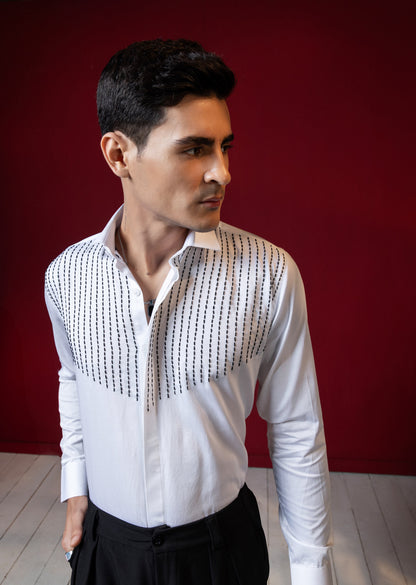LINES OF THREAD EMBROIDERED ON A WHITE SHIRT