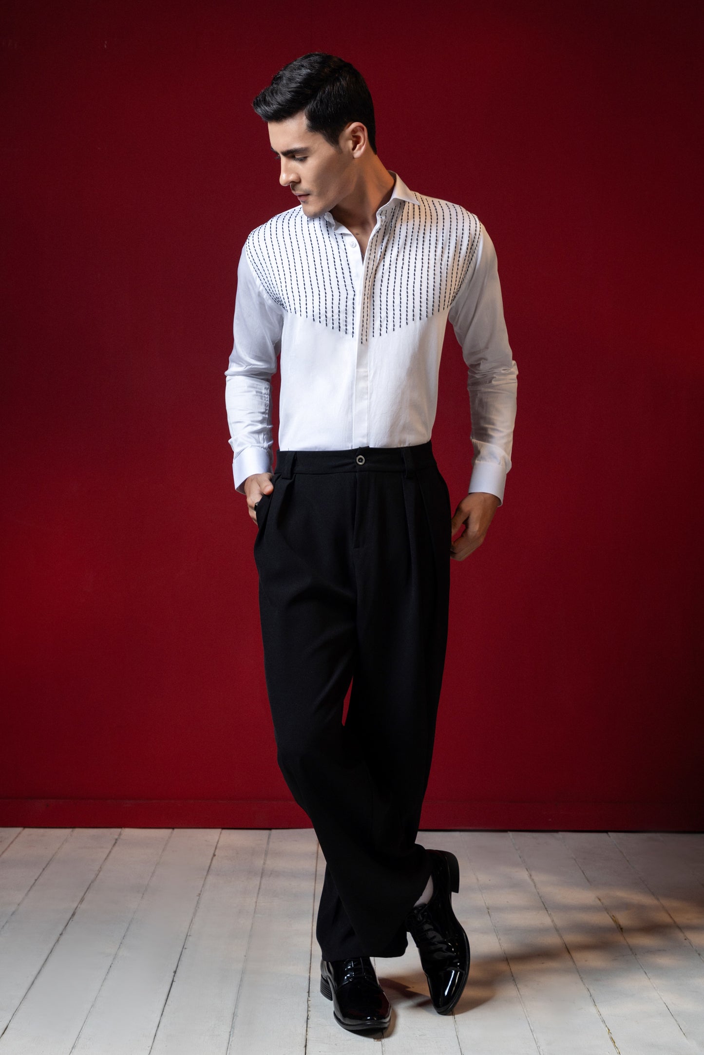 LINES OF THREAD EMBROIDERED ON A WHITE SHIRT