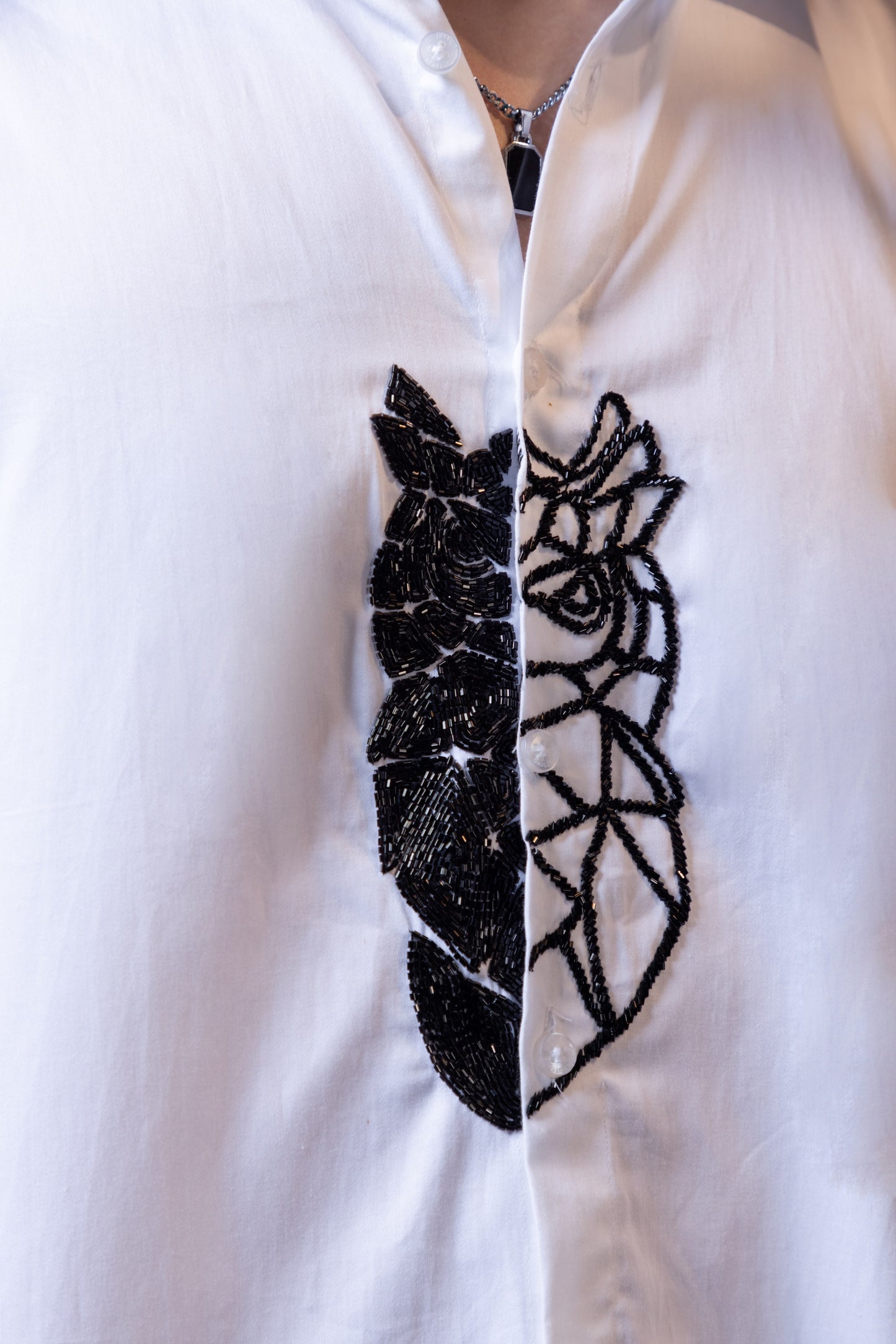 OWL EMBROIDERED ON A WHITE SHIRT