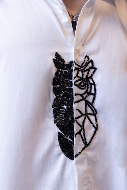 OWL EMBROIDERED ON A WHITE SHIRT