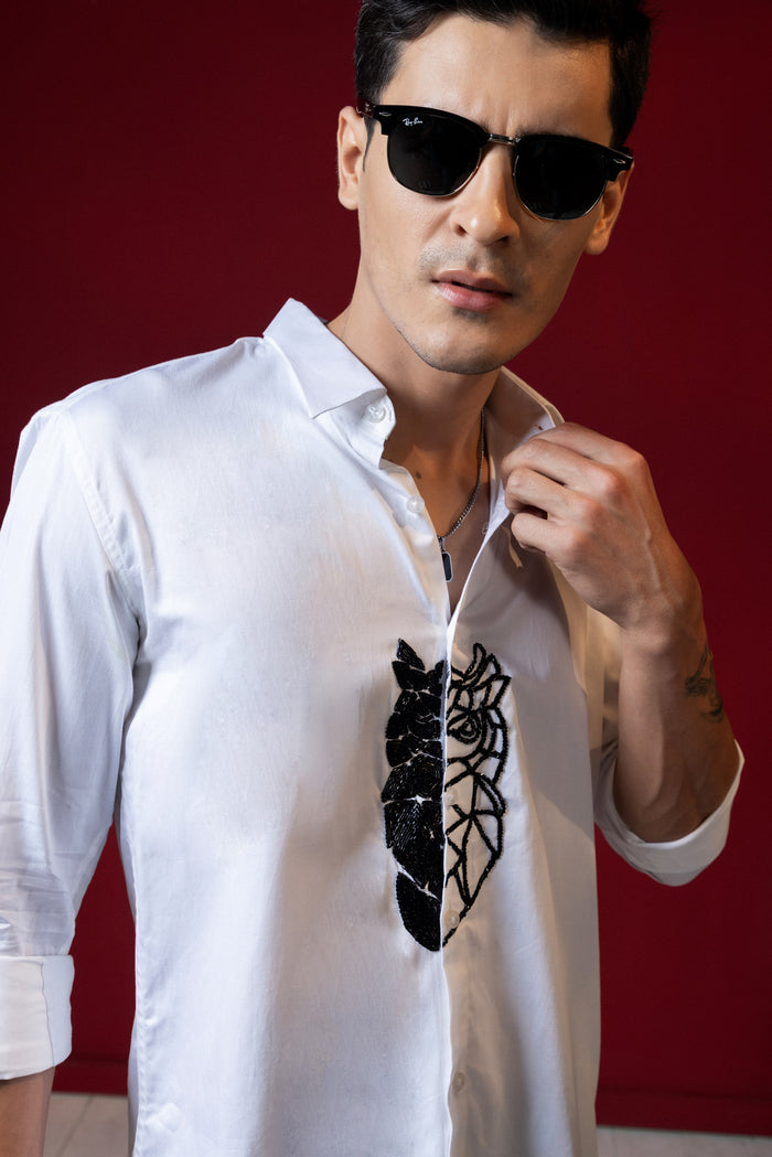 "OWL" EMBROIDERED ON A WHITE SHIRT