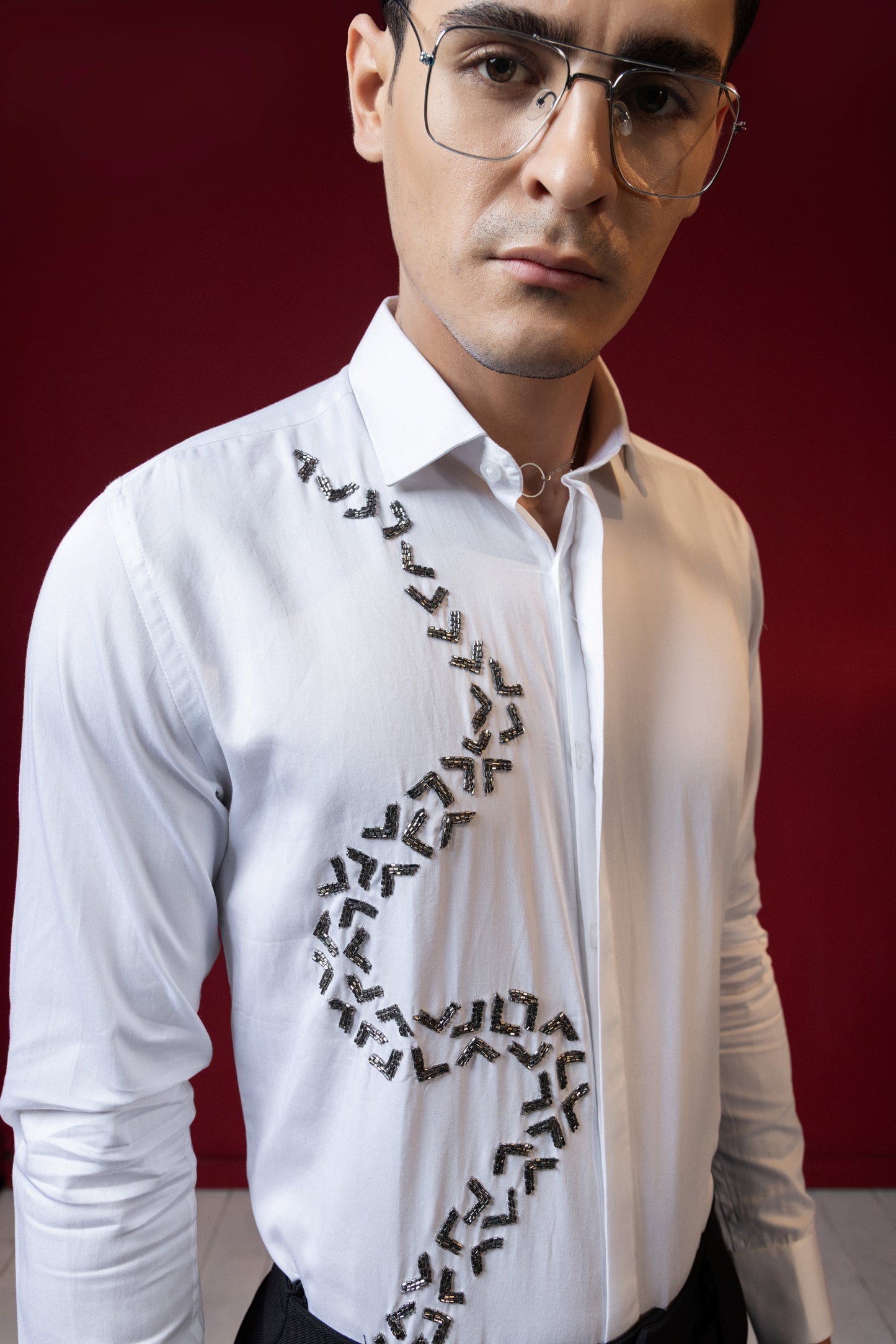 V SHAPED EMBROIDERY ON A WHITE SHIRT
