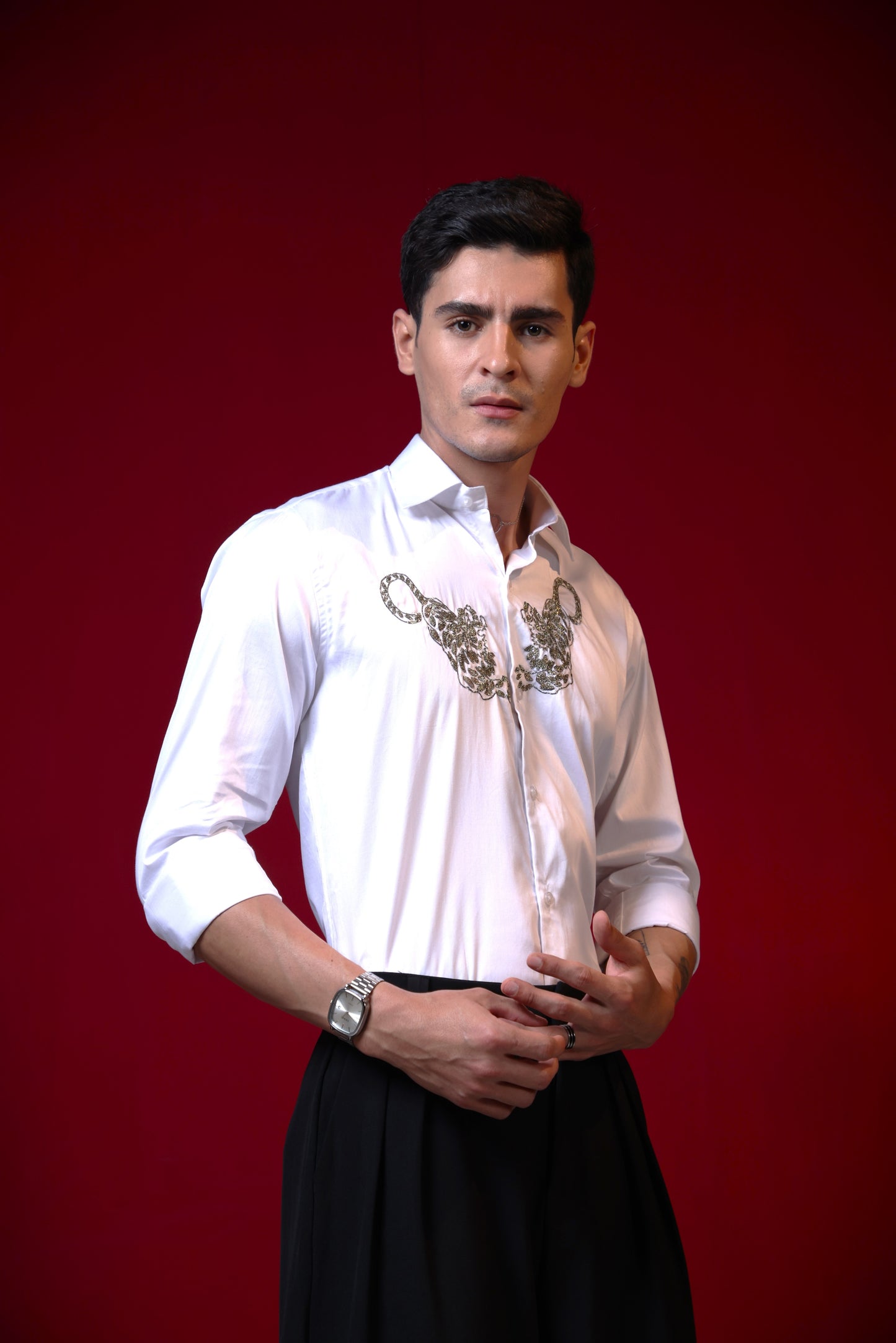 TWO TIGERS EMBROIDERED ON A WHITE SHIRT