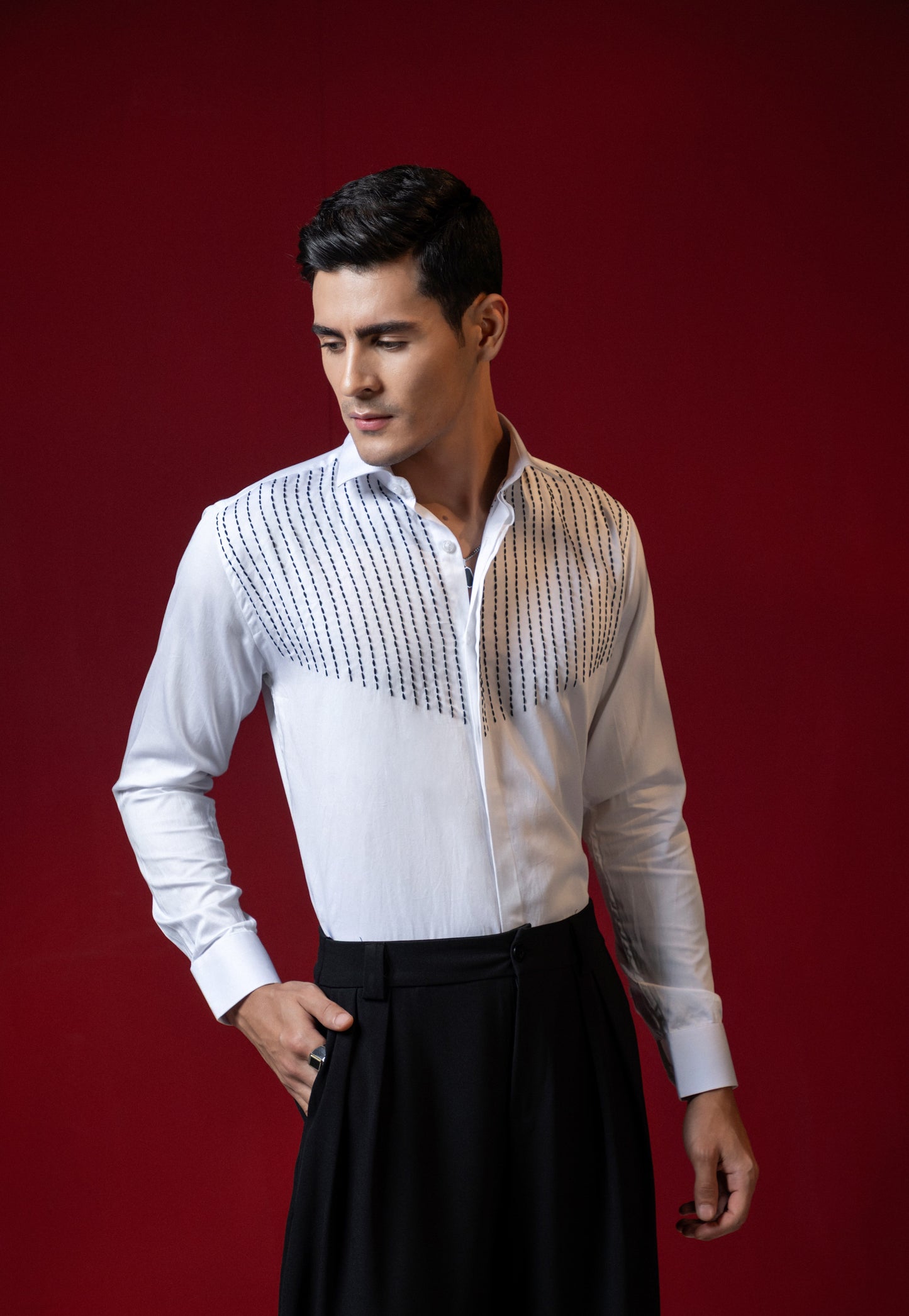 LINES OF THREAD EMBROIDERED ON A WHITE SHIRT
