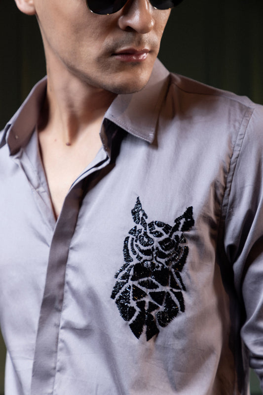 OWL EMBROIDERED ON A GRAY SHIRT
