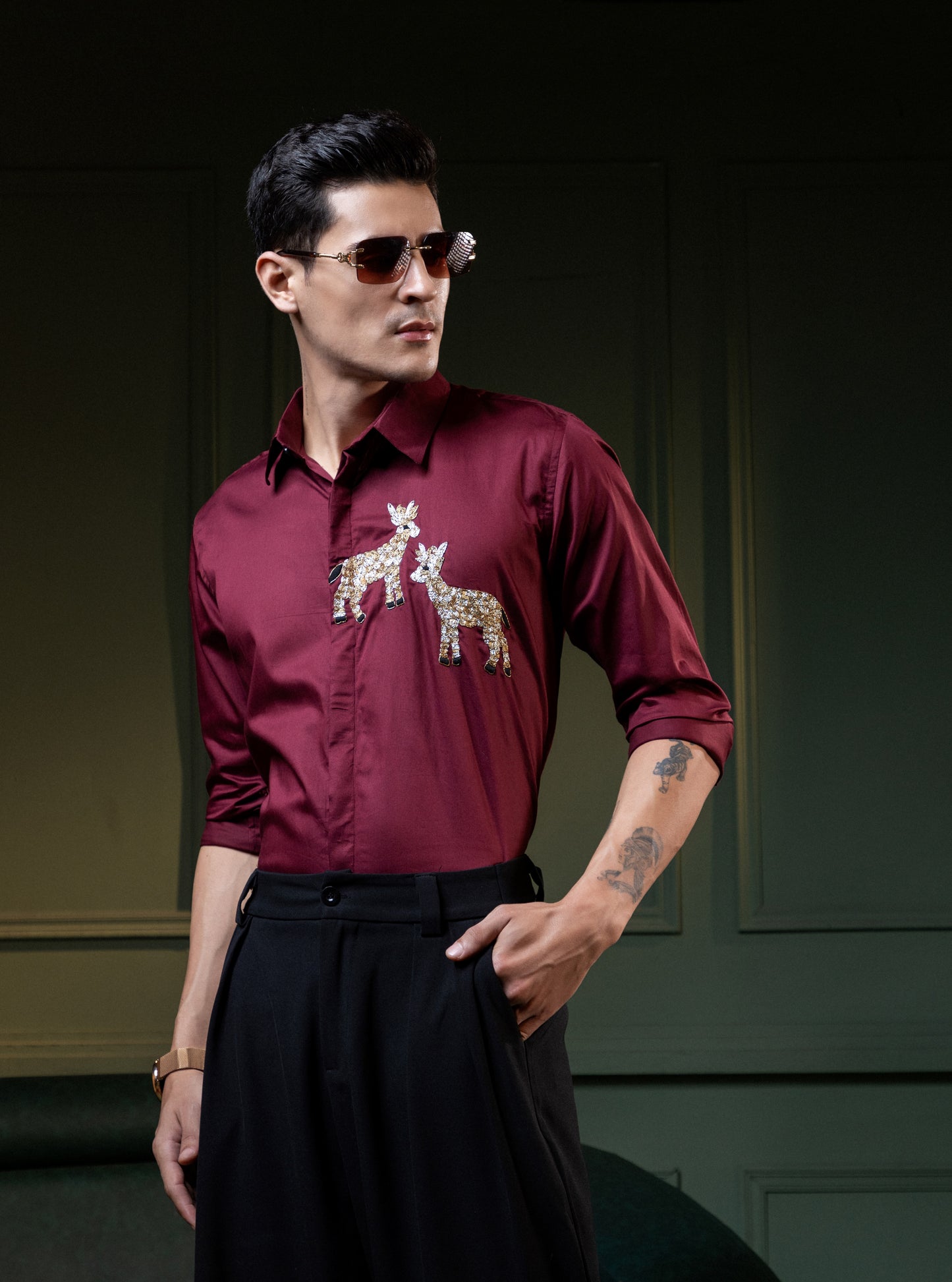 TWO DEER EMBROIDERED ON A MAROON SHIRT