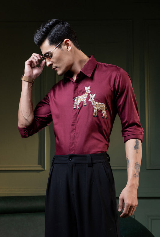 TWO DEER EMBROIDERED ON A MAROON SHIRT