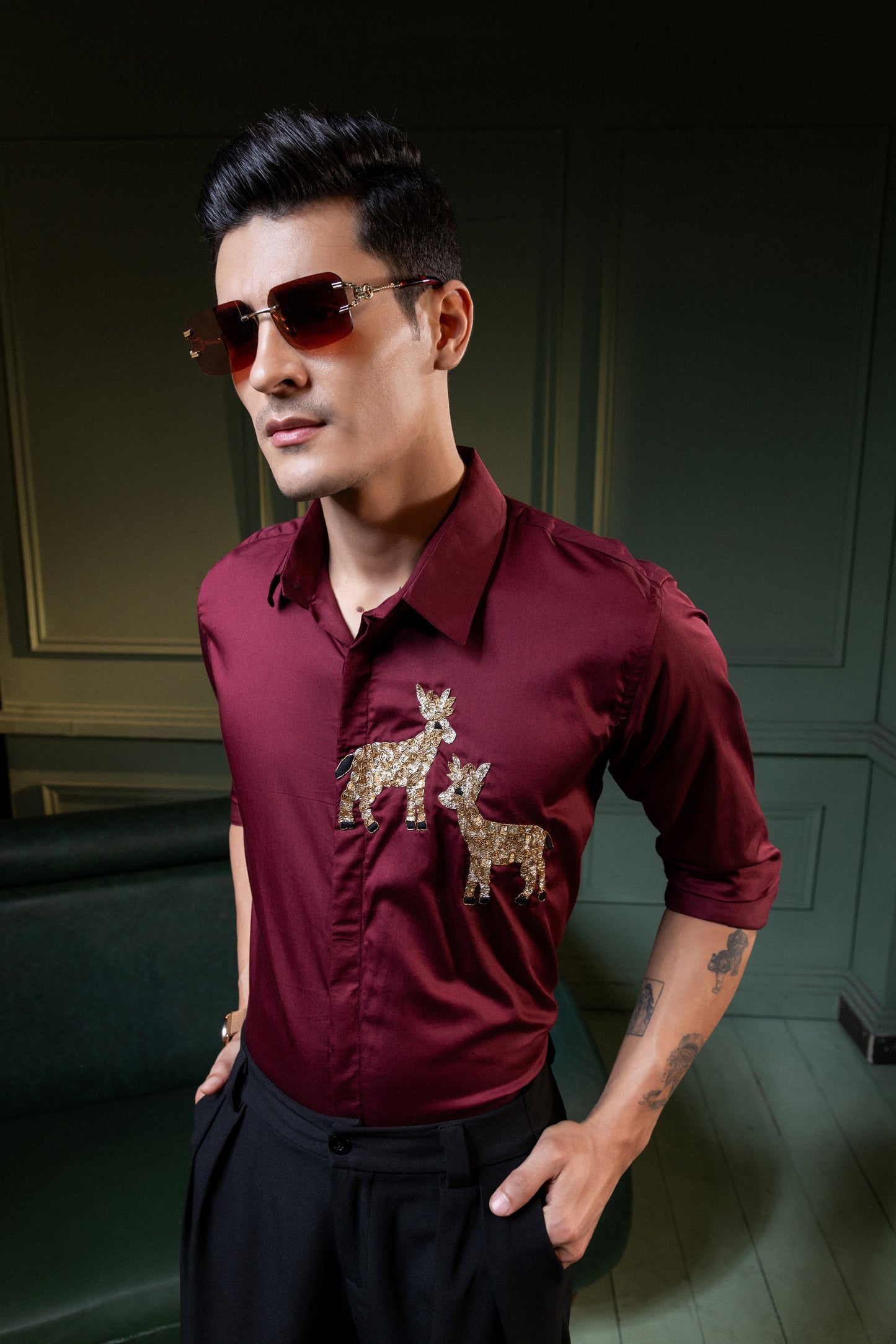 TWO DEER EMBROIDERED ON A MAROON SHIRT