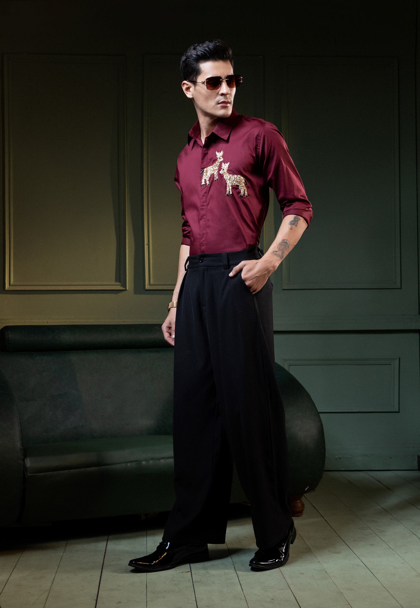 TWO DEER EMBROIDERED ON A MAROON SHIRT