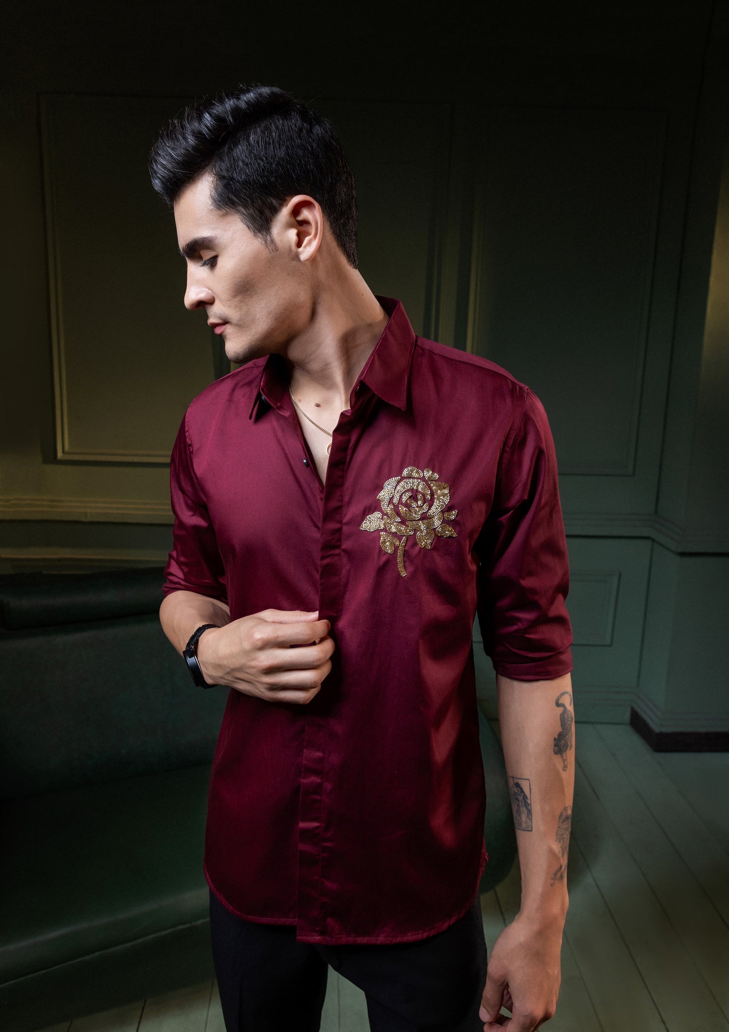 GOLDEN FLOWER EMBROIDERED ON A MAROON SHIRT