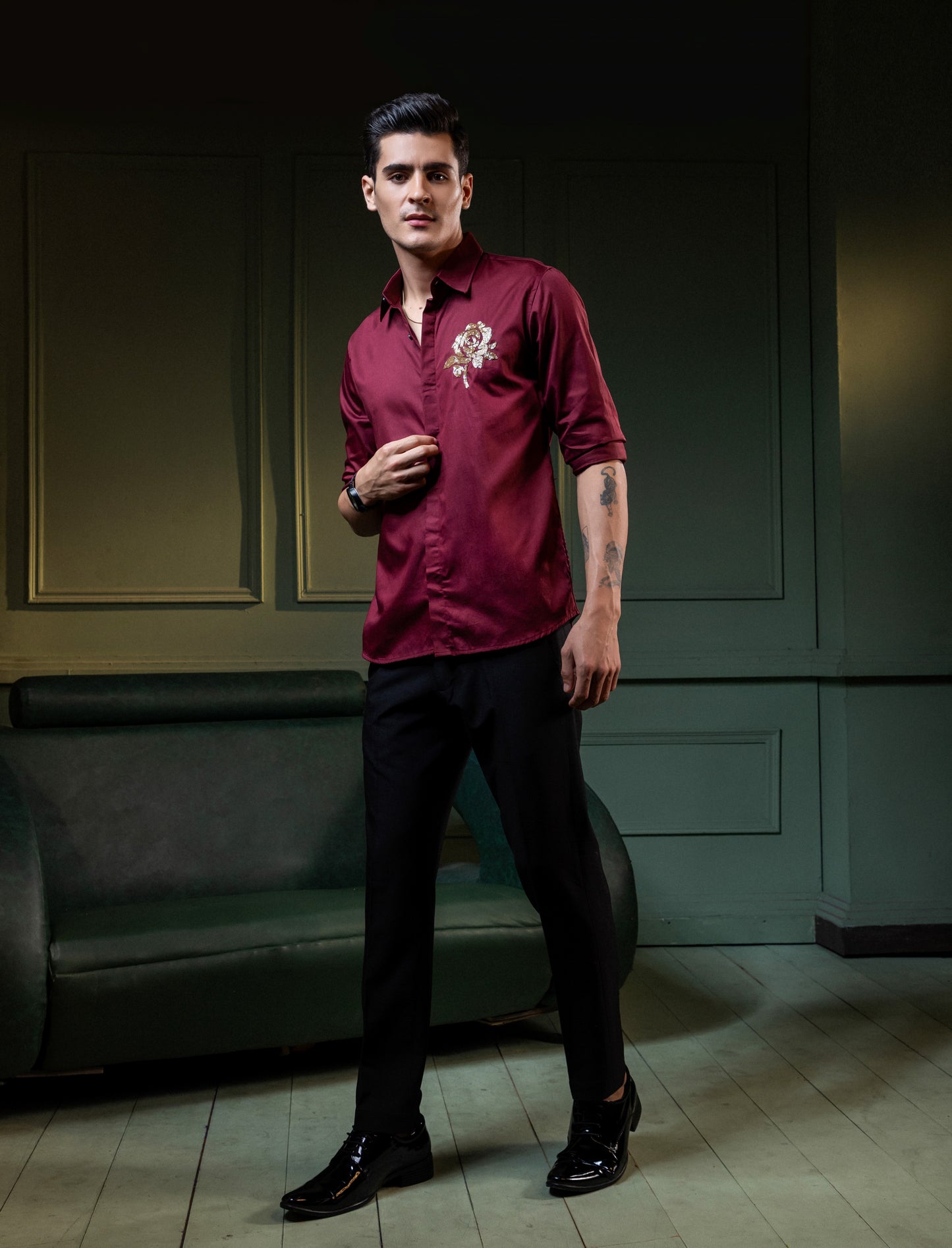 GOLDEN FLOWER EMBROIDERED ON A MAROON SHIRT
