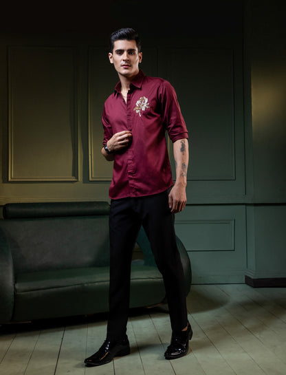 GOLDEN FLOWER EMBROIDERED ON A MAROON SHIRT