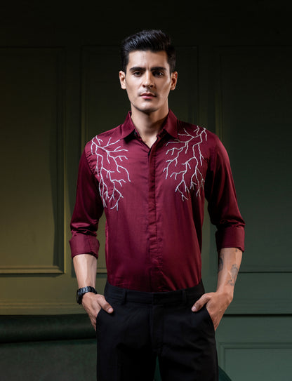SILVER LIGHT EMBROIDERED ON A MAROON SHIRT