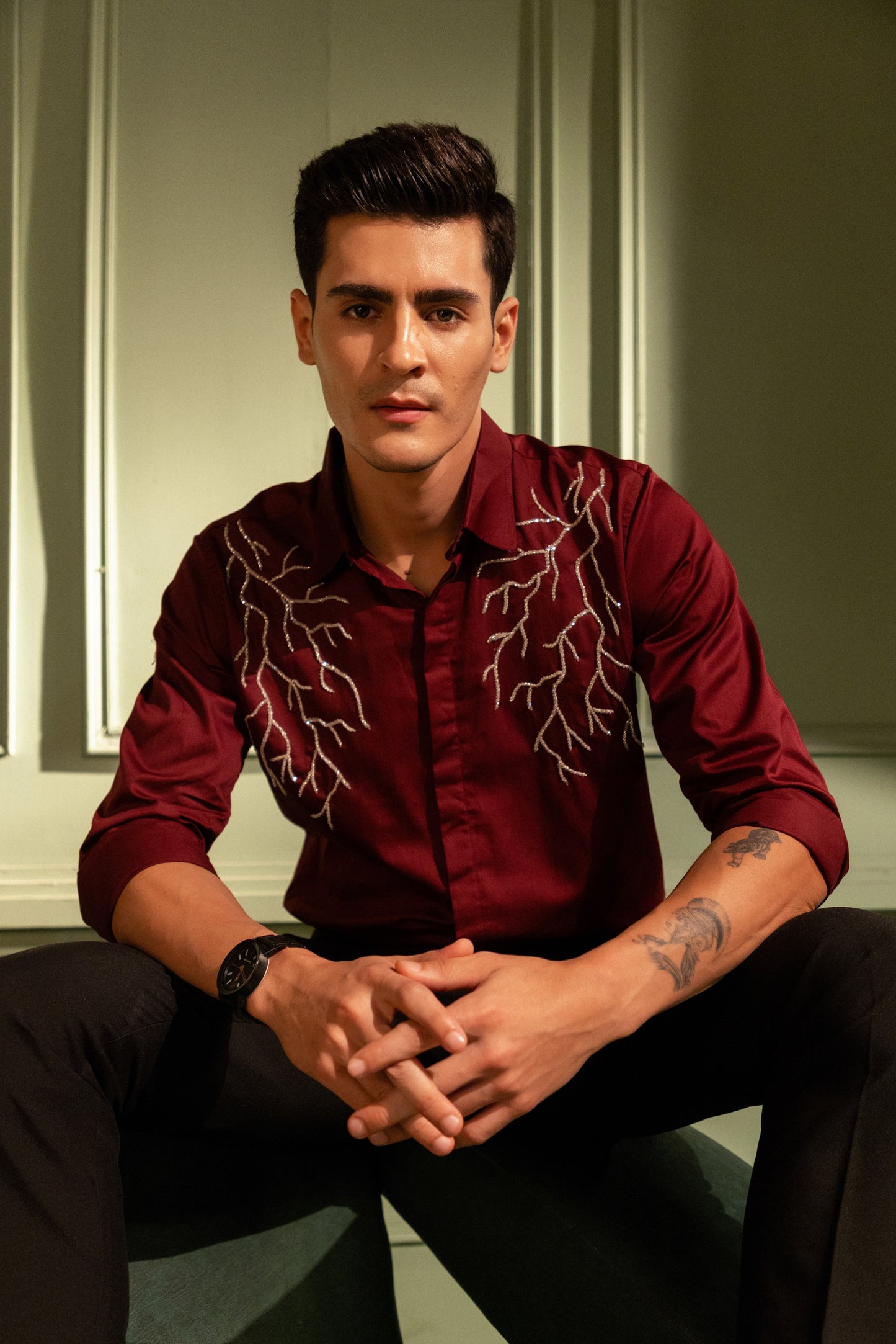SILVER LIGHT EMBROIDERED ON A MAROON SHIRT